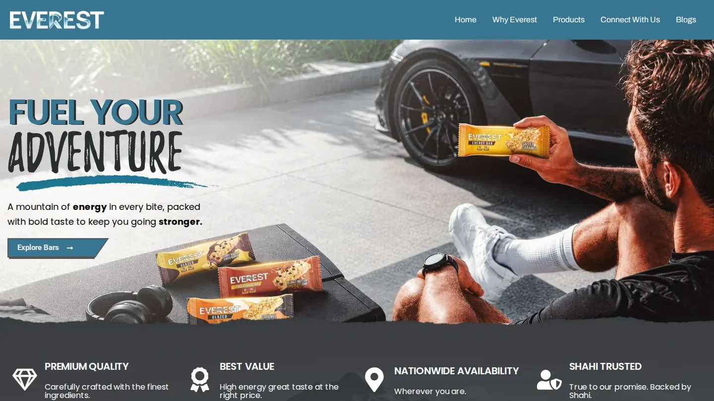 Everest Snacks home page on desktop: the headline Fuel your adventure beside a man holding an energy bar